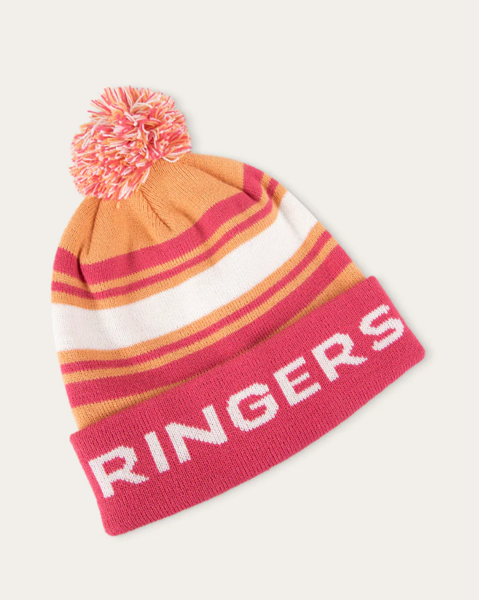 Striped beanie with pom-pom on a plain background
