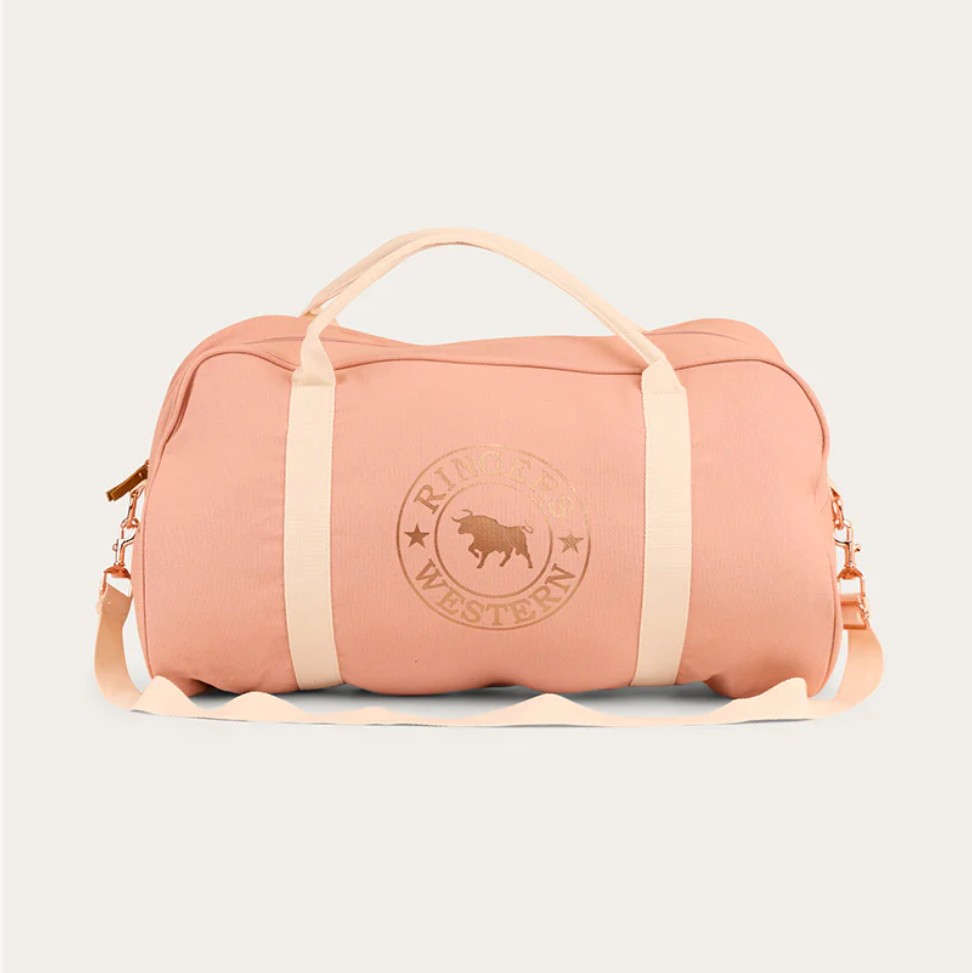 Pink duffel bag with beige straps on a light gray background