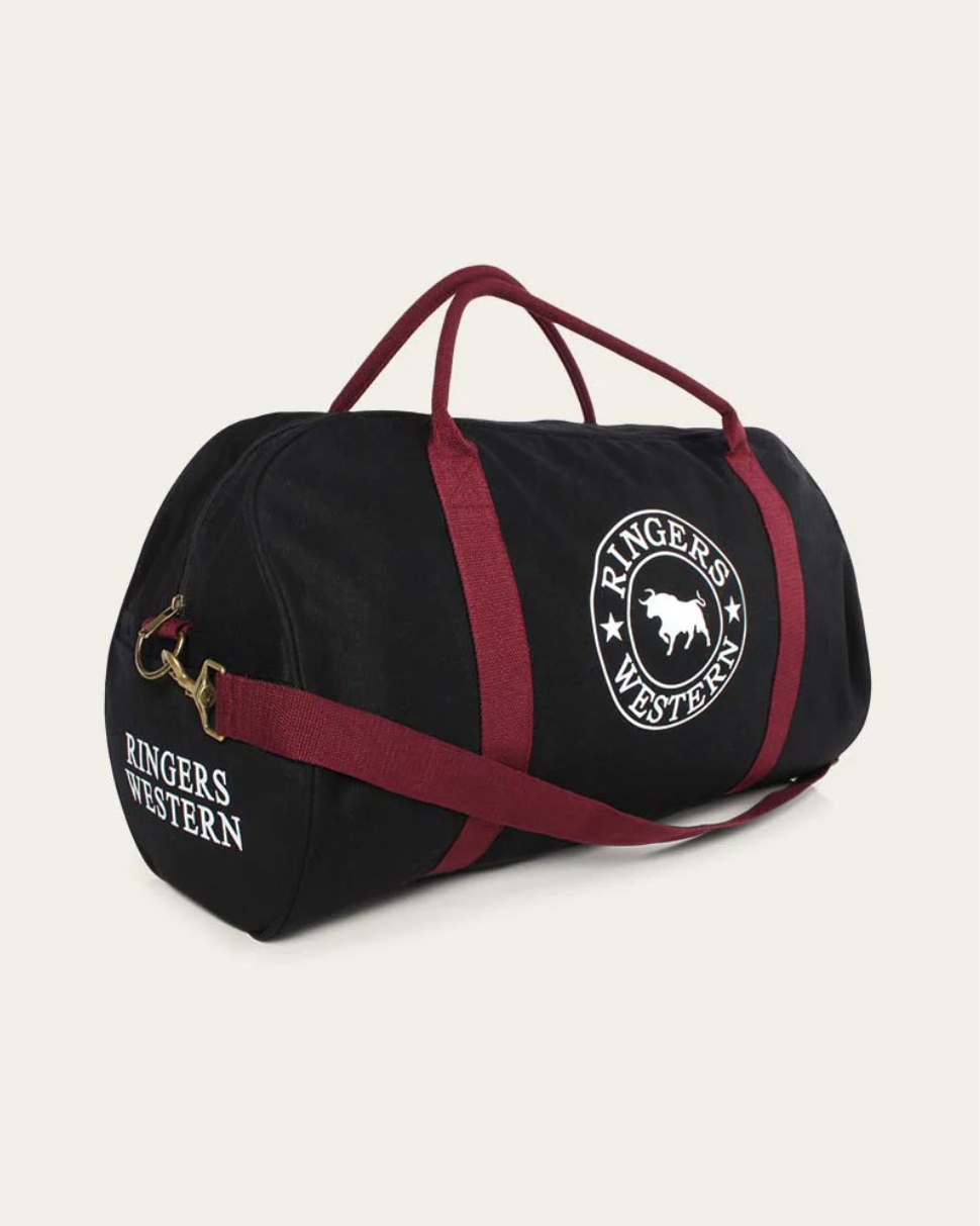 Black duffel bag with red straps and 'Ringers Western' branding on a light gray background