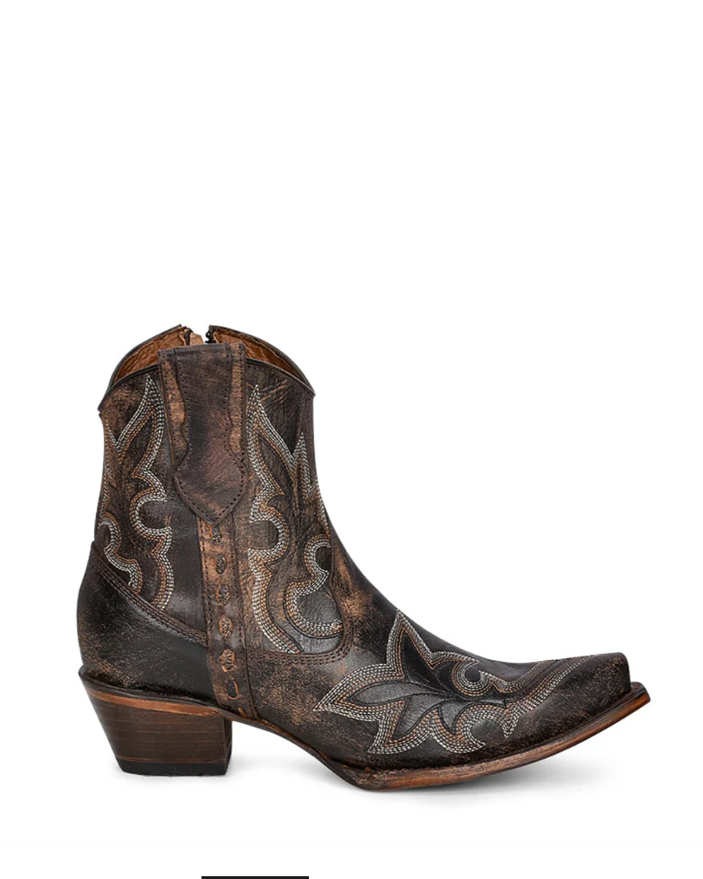 Brown cowboy boot with intricate patterns on a white background
