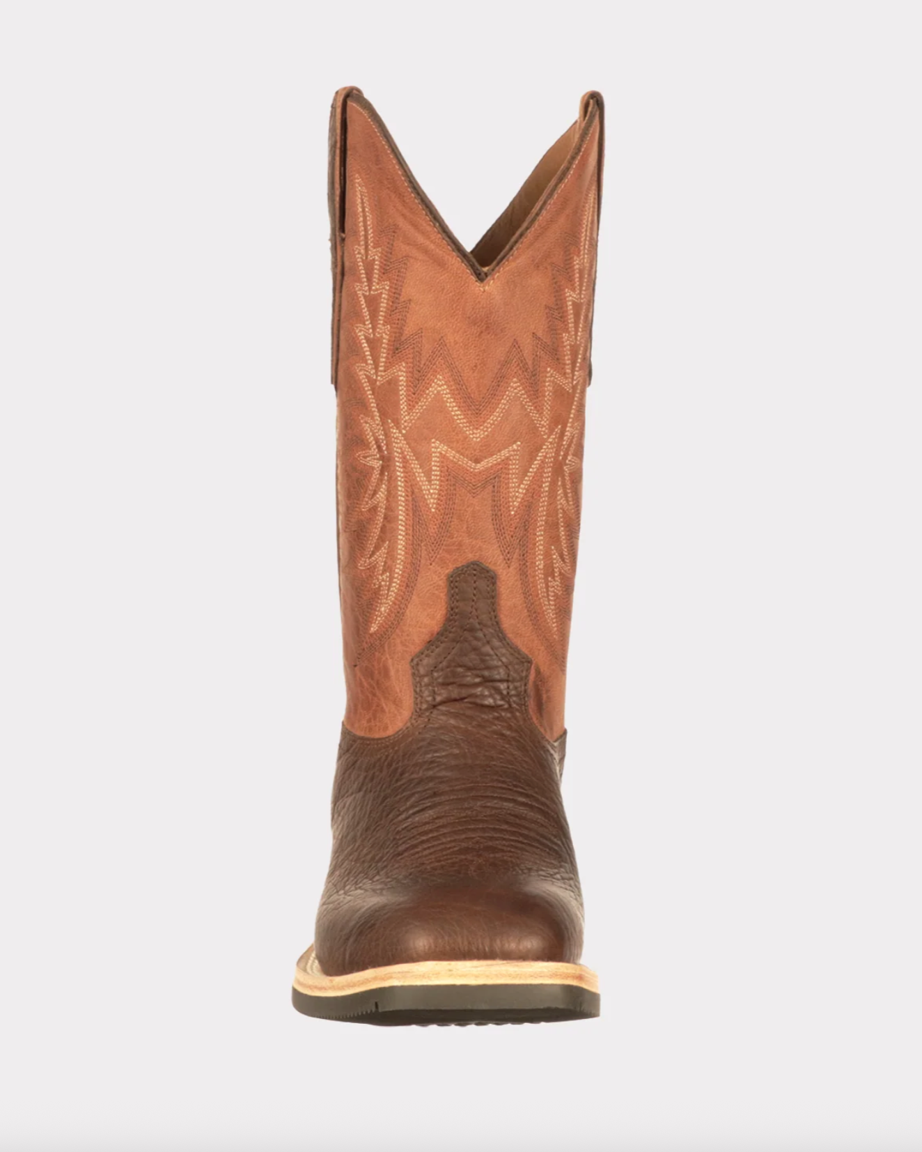 Brown cowboy boot with intricate design on a white background