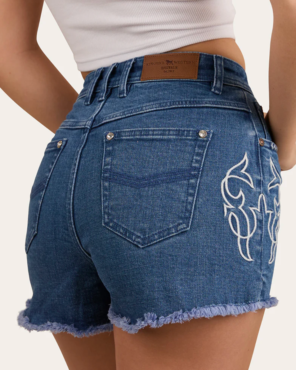 Blue denim shorts with a white design on a plain background