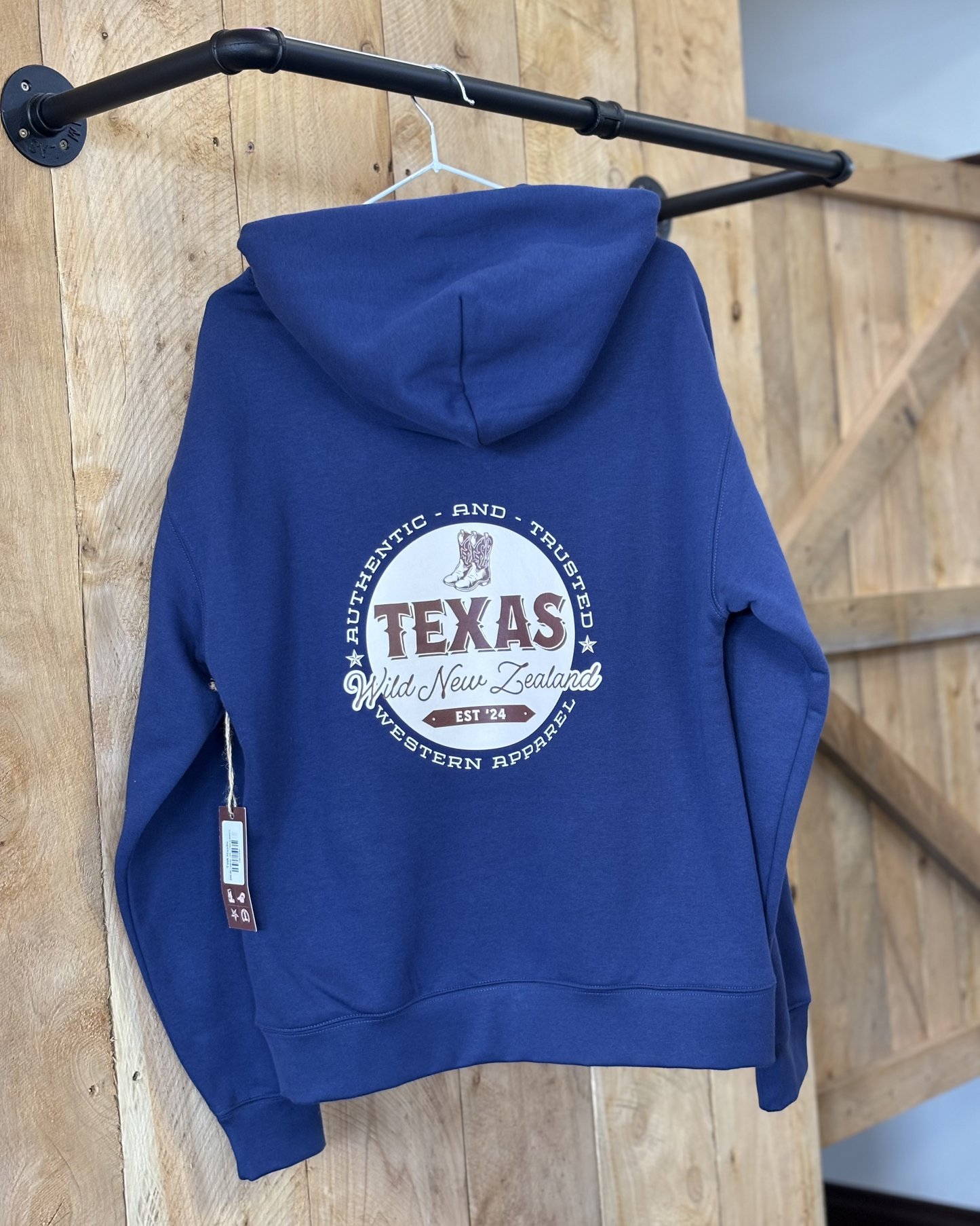 Cobalt Blue Texas Western Apparel hoodie with intricate embroidery. The front features a detailed embroidered 'T' and a Western-style boot, while the back showcases the Texas Western Apparel logo. A bold and stylish statement piece with a classic country flair.