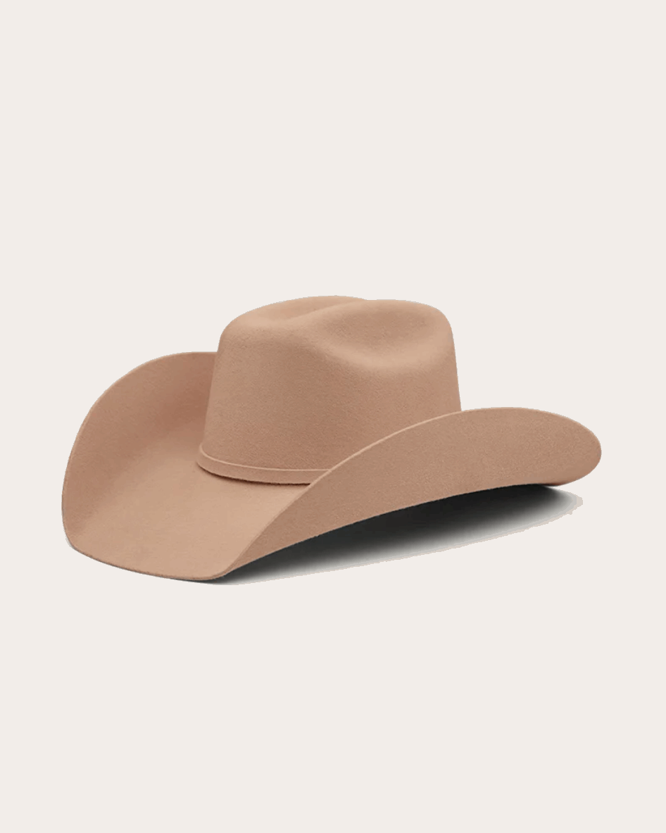 A classic beige cowboy hat by Ringers Western, made of premium felt with a structured crown and a wide, upturned brim. A silver buckle accent on the hatband adds a refined touch.