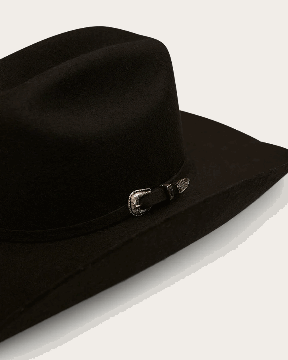 A classic black cowboy hat by Ringers Western, made of premium felt with a structured crown and a wide, upturned brim. A silver buckle accent on the hatband adds a refined touch.