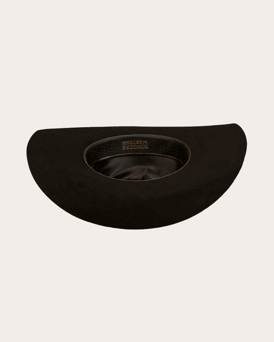 A classic black cowboy hat by Ringers Western, made of premium felt with a structured crown and a wide, upturned brim. A silver buckle accent on the hatband adds a refined touch.