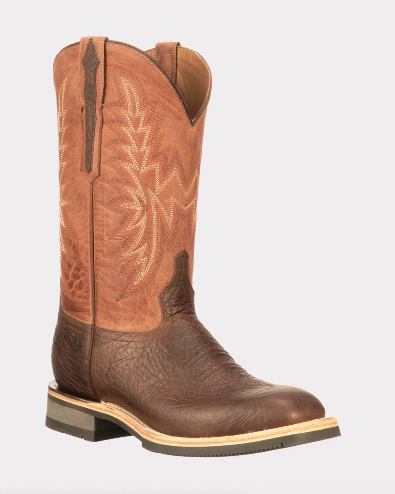 Brown cowboy boot with intricate stitching on a white background