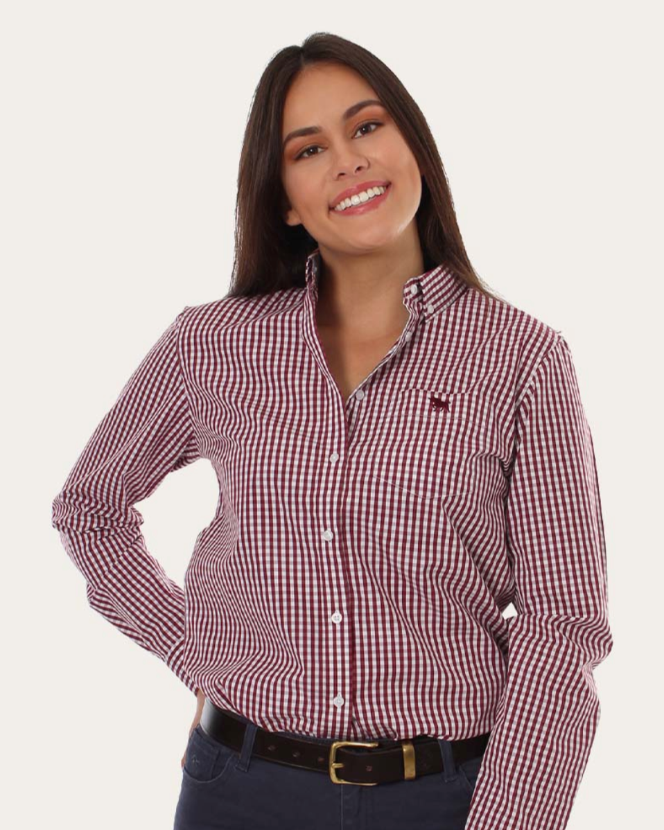 Woman wearing a red and white checkered shirt with a plain background