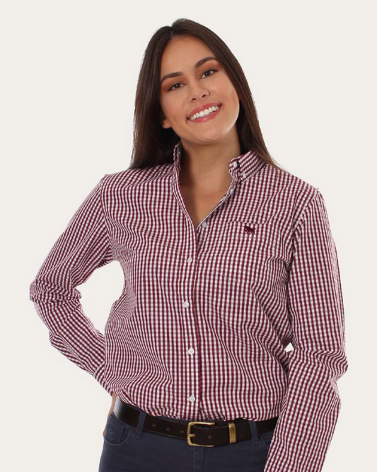 Woman wearing a red and white checkered shirt with a plain background