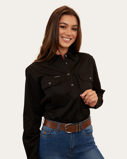 Woman wearing a black shirt and blue jeans on a white background