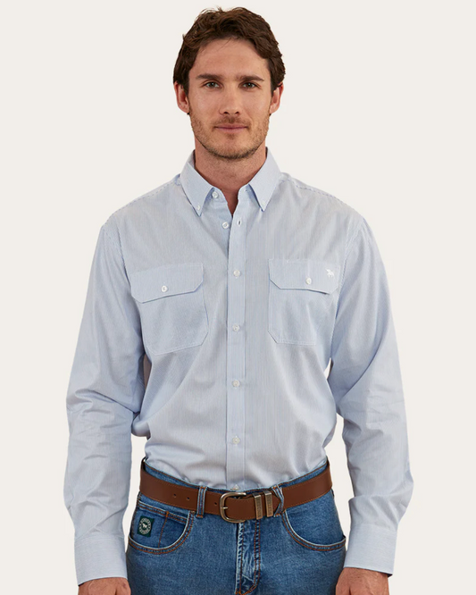 Man wearing a light blue button-up shirt and jeans on a white background