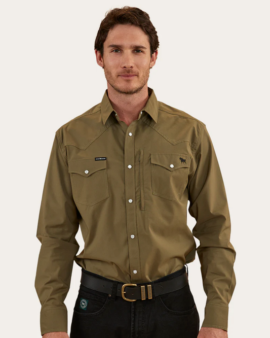 Man wearing a green shirt and black pants on a white background