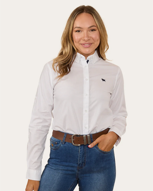 Woman wearing a white shirt with a small logo and blue jeans on a white background