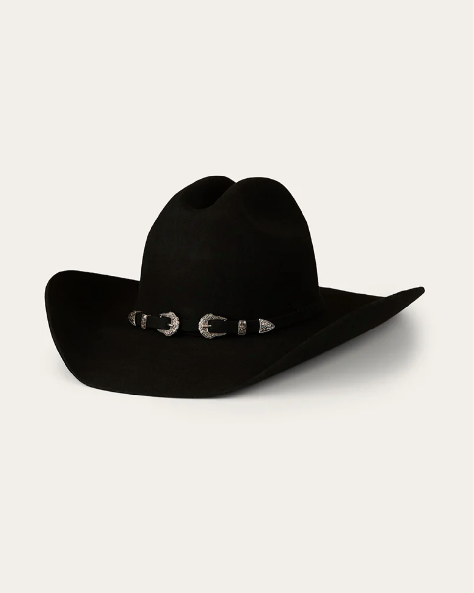Black cowboy hat with a decorative band on a white background