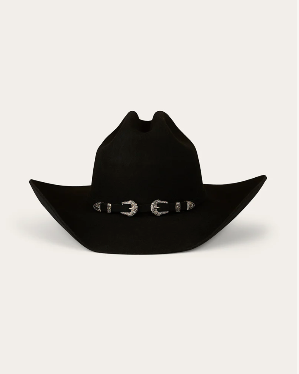 Black cowboy hat with a decorative band on a light gray background