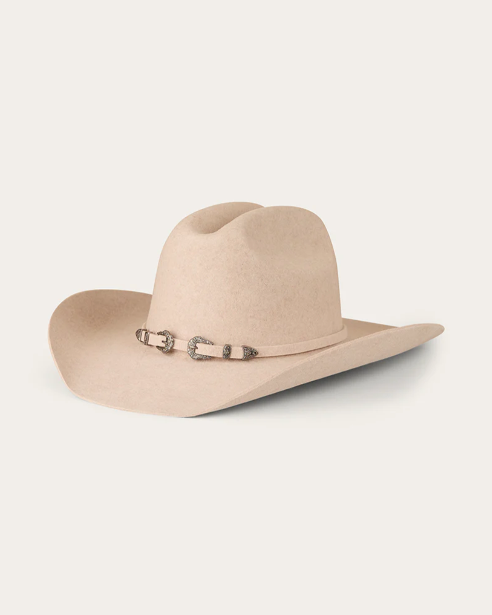 Beige cowboy hat with a band on a white background