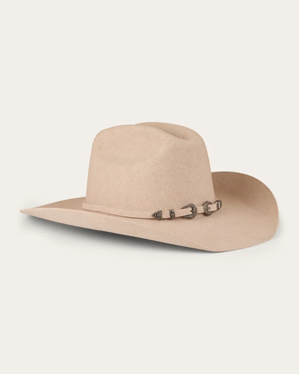 Beige cowboy hat with a decorative band on a white background