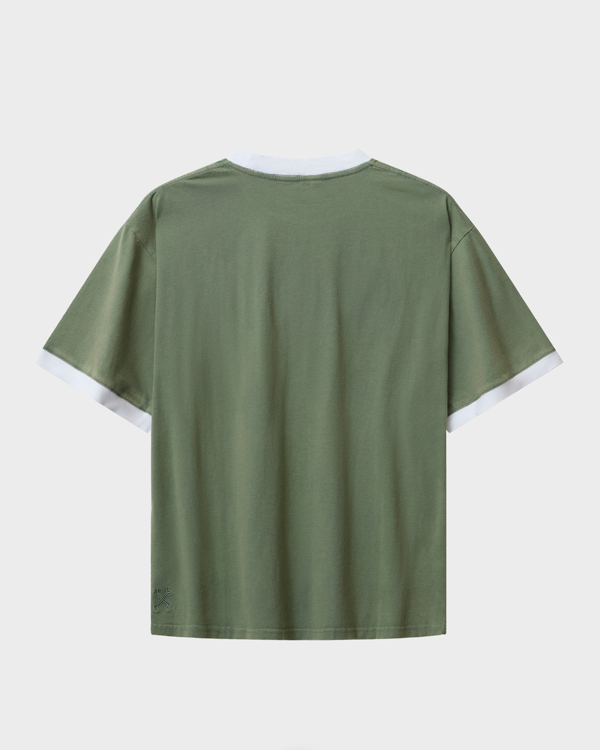 Green t-shirt with white trim on a light gray background