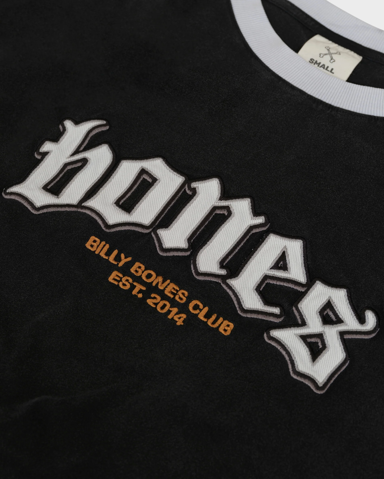Black t-shirt with 'hones' and 'Billy Bones Club' text on a dark background