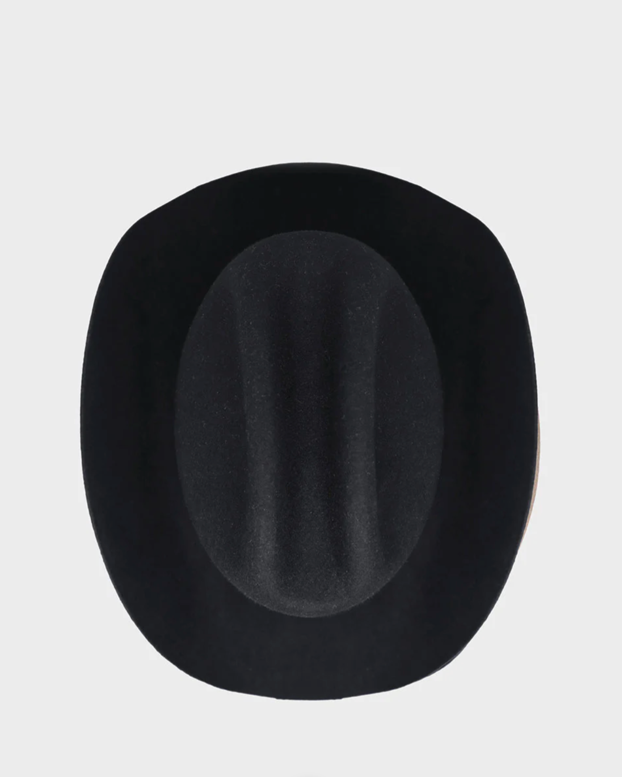 Black fedora hat on a light gray background