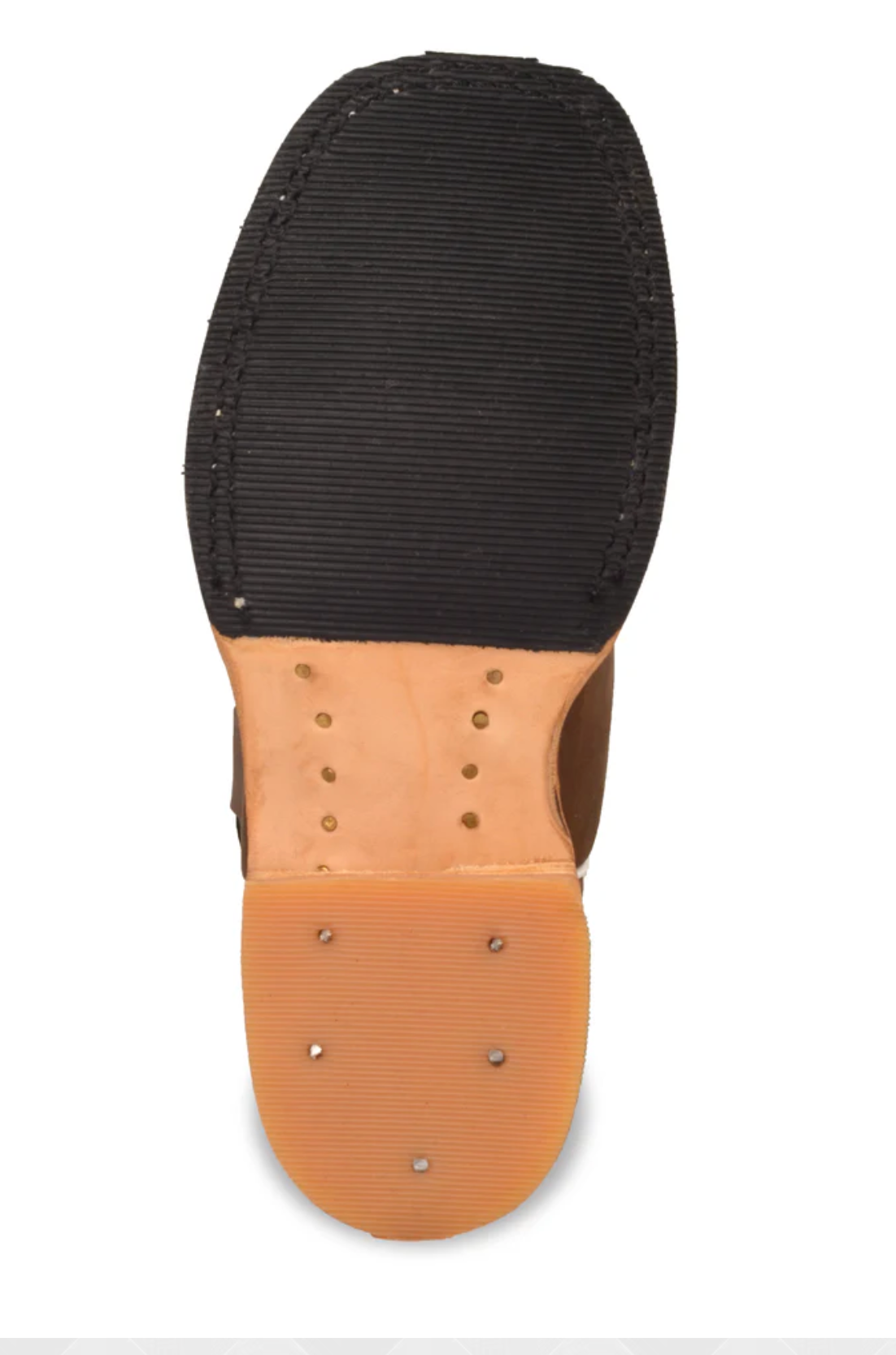 Close-up of a shoe sole with black rubber and brown leather insole on a white background