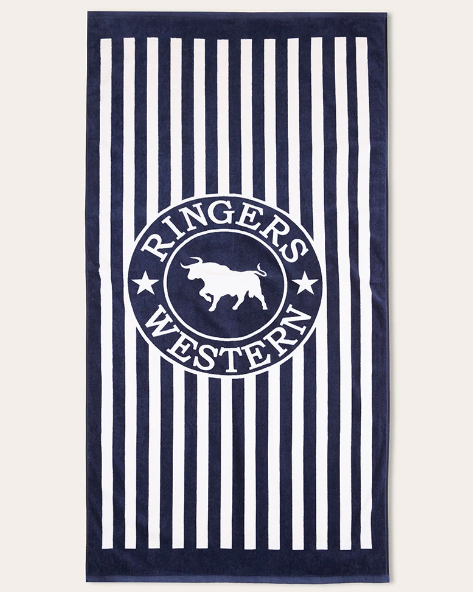 Navy and white striped towel with a circular logo featuring a bull and text on a white background