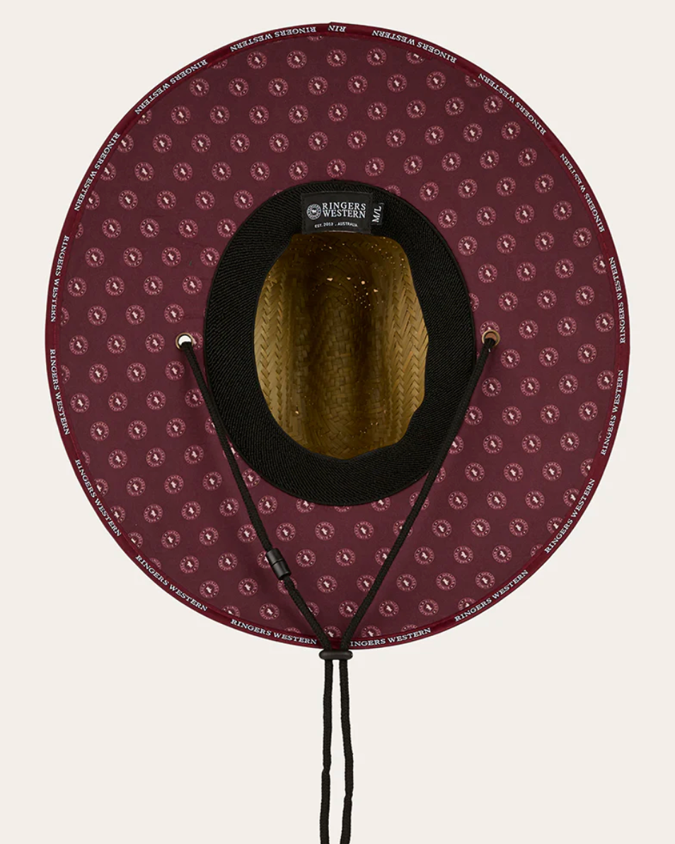 Purple patterned hat with a black interior on a white background