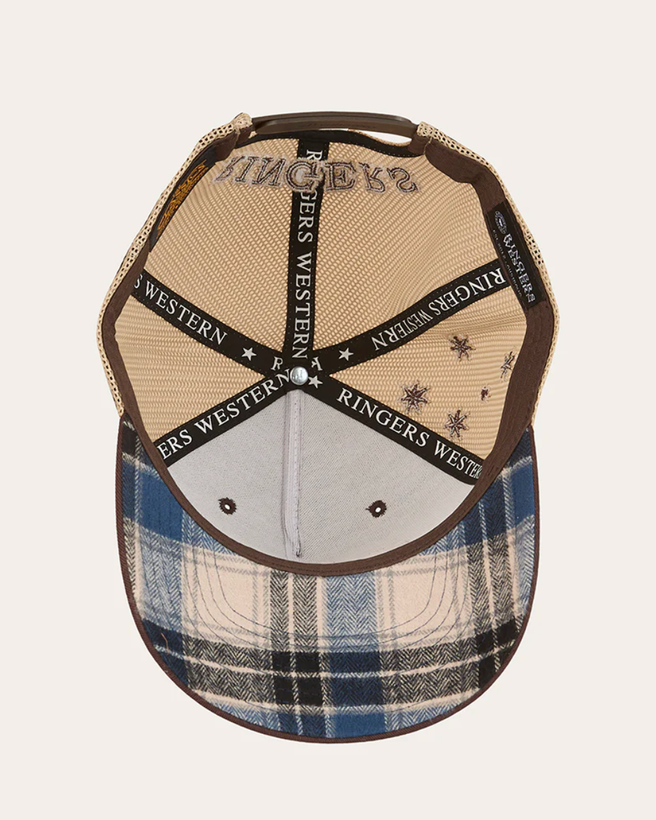 Plaid patterned cap with branding on a light gray background