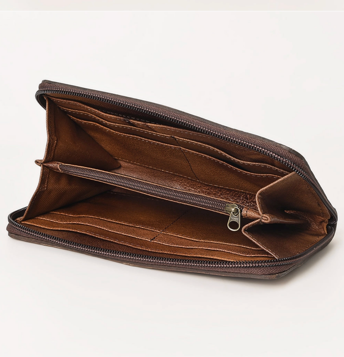 Brown leather wallet with a zipper on a white background