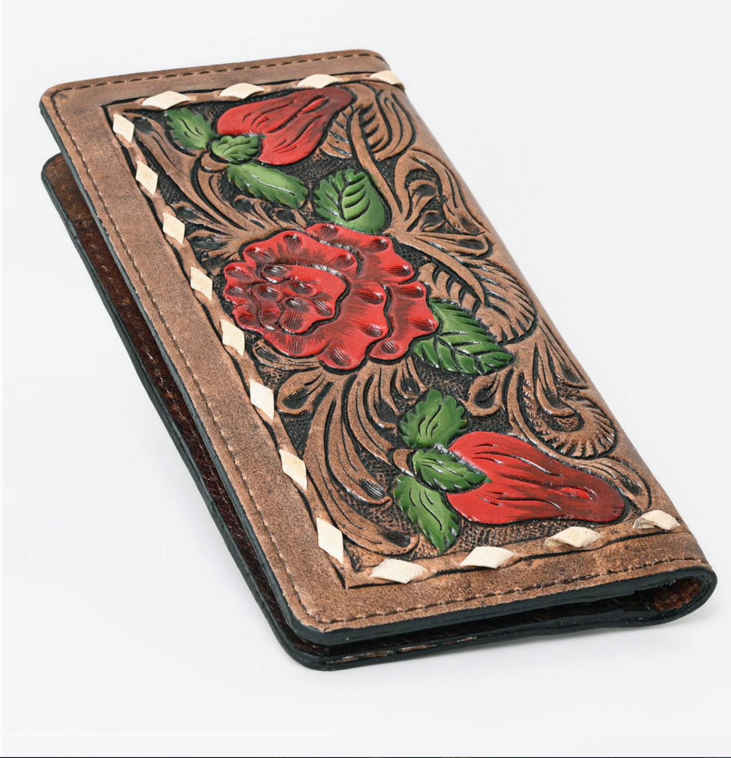 Handcrafted leather wallet with floral designs on a white background