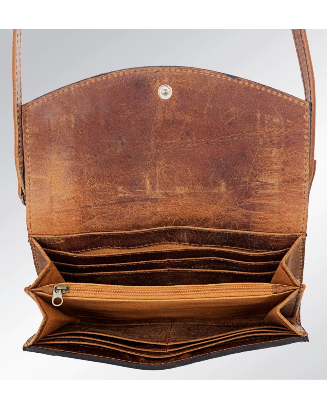 Brown leather handbag with open front pocket on a light gray background