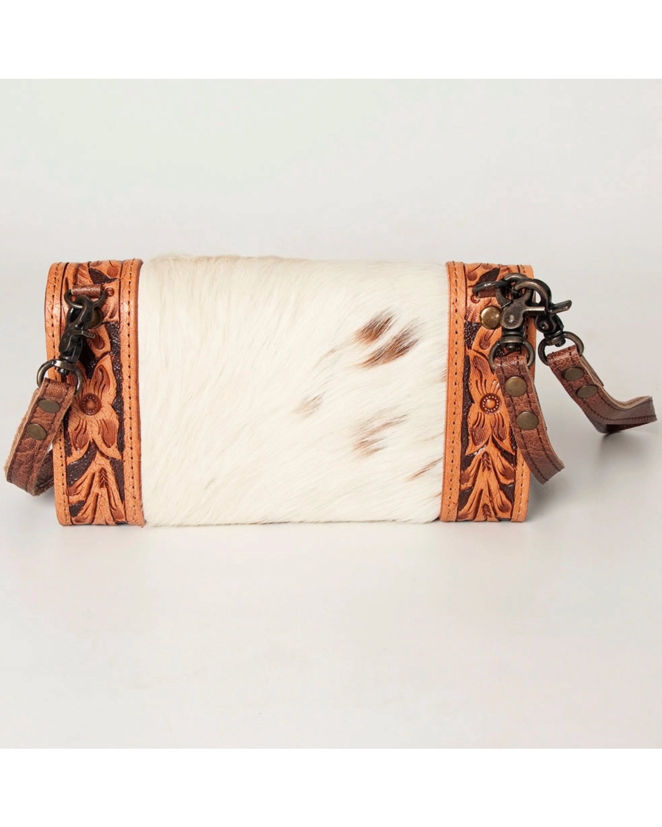 Leather wallet with intricate designs on a white background