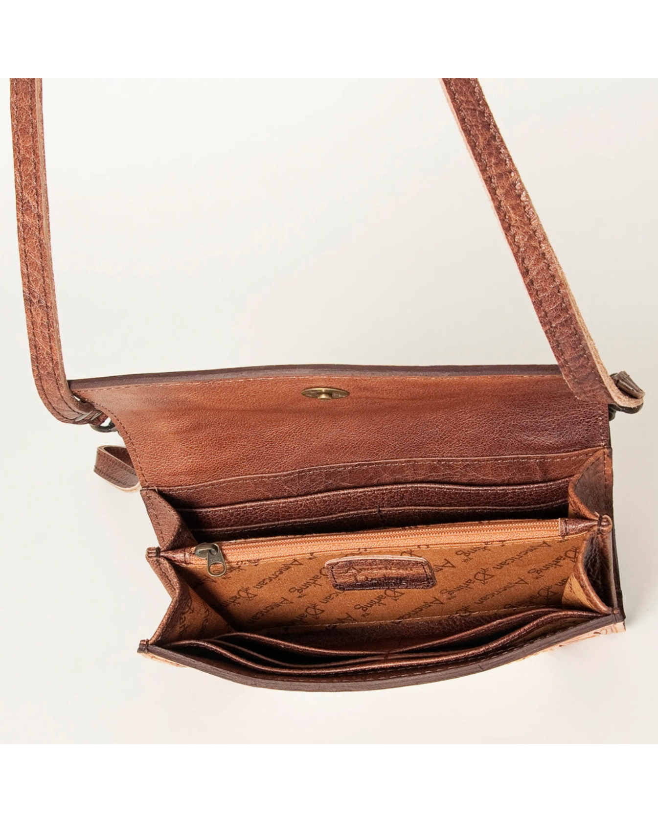 Brown leather crossbody bag on a white background