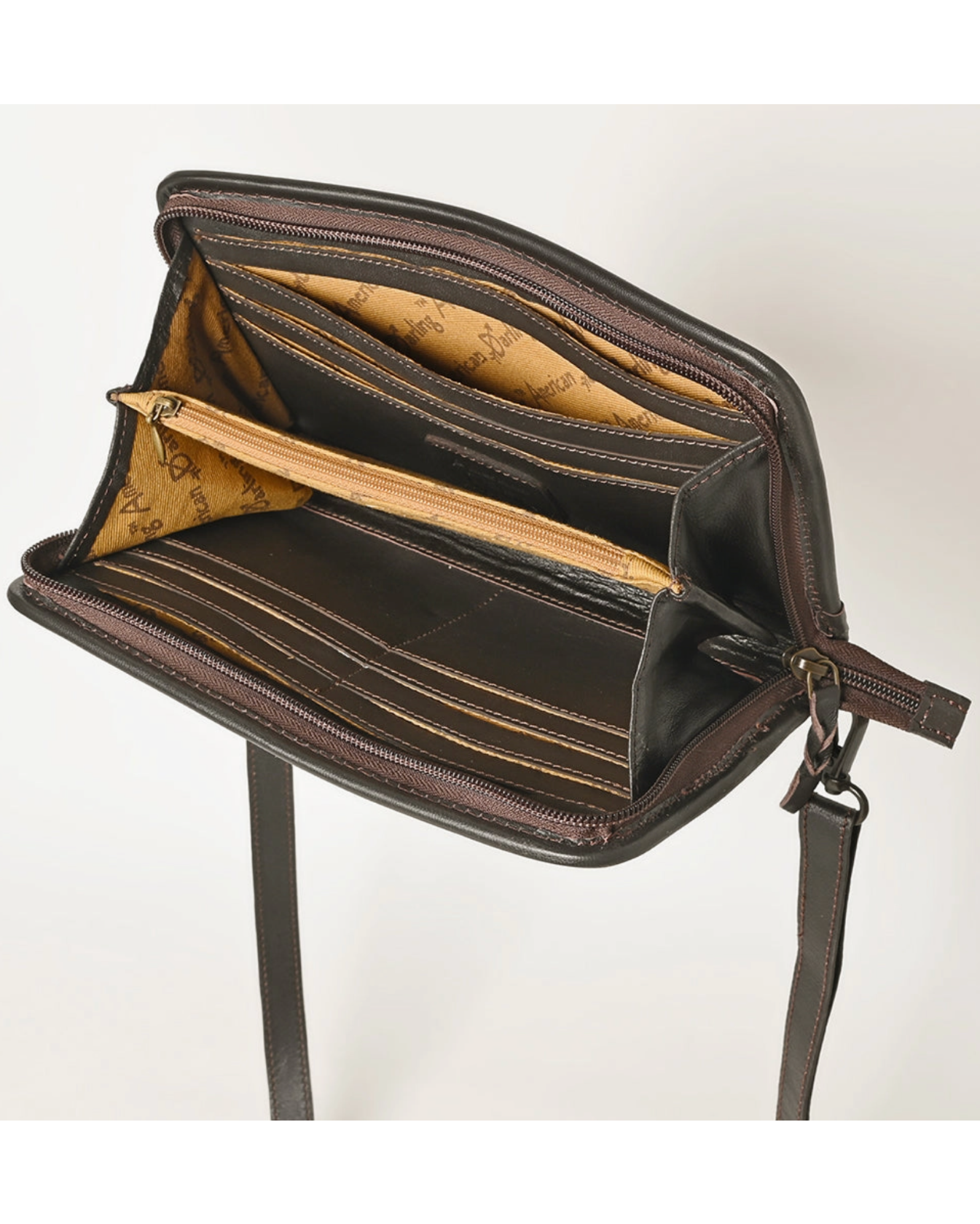 Brown leather handbag with a strap on a white background