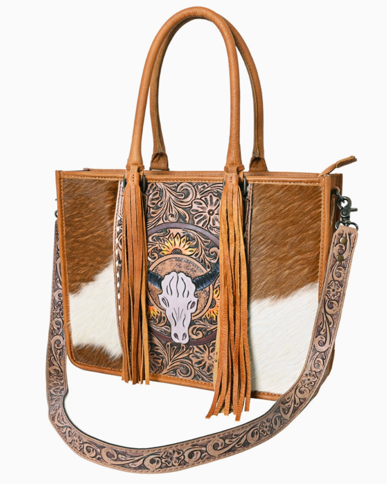 Brown and white handbag with decorative patterns and fringes on a white background