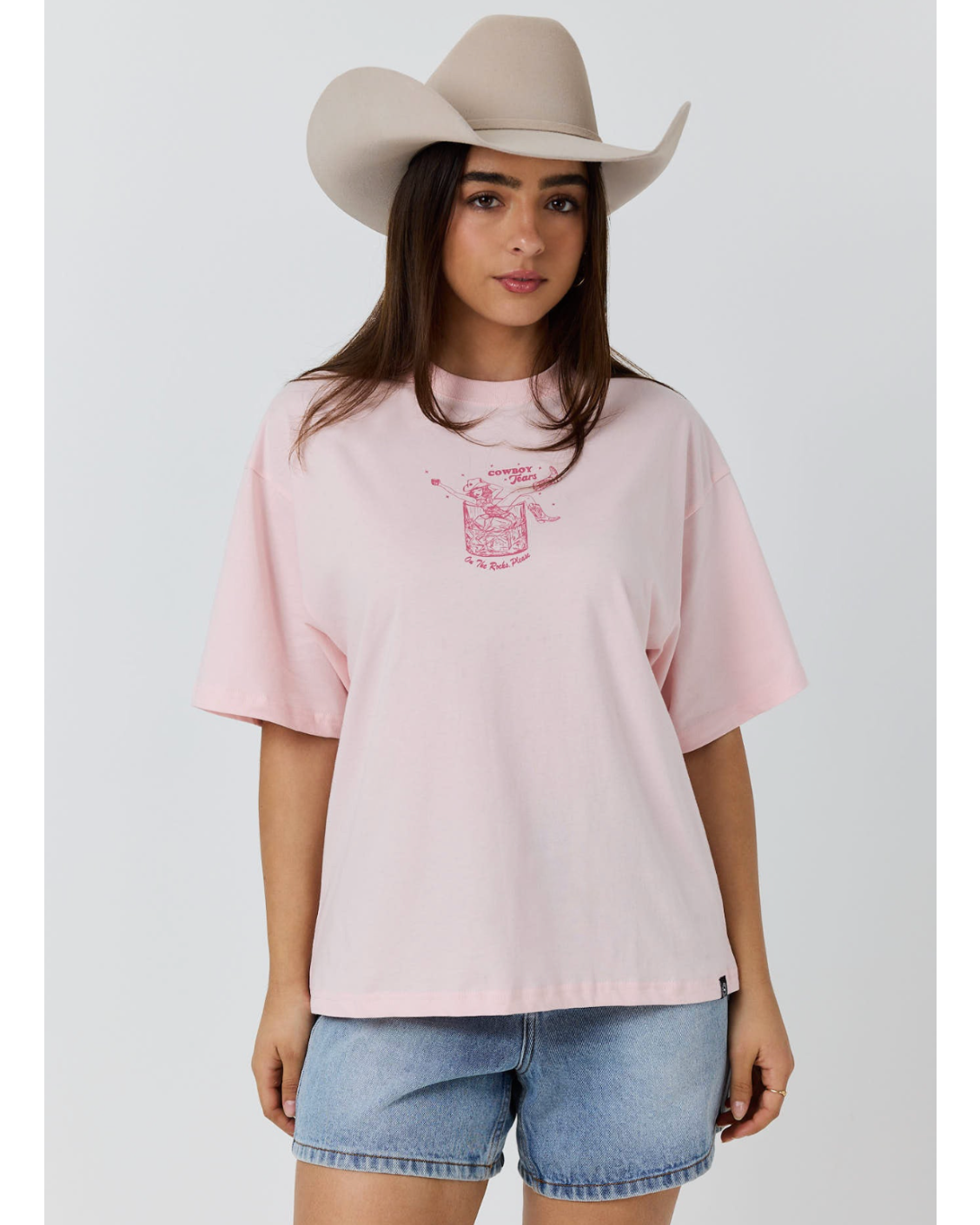 Ringers Western: Womans baby pink 100% cotton graphic tee, featuring a cowgirl graphic on the front - Texas Western Apparel New Zealand