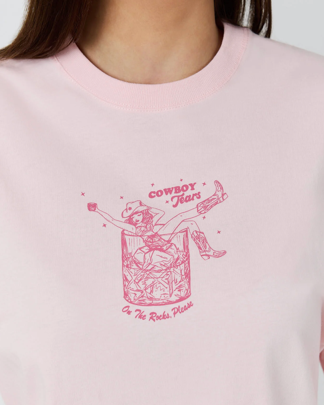 Ringers Western: Womans baby pink 100% cotton graphic tee, featuring a cowgirl graphic on the front - Texas Western Apparel New Zealand