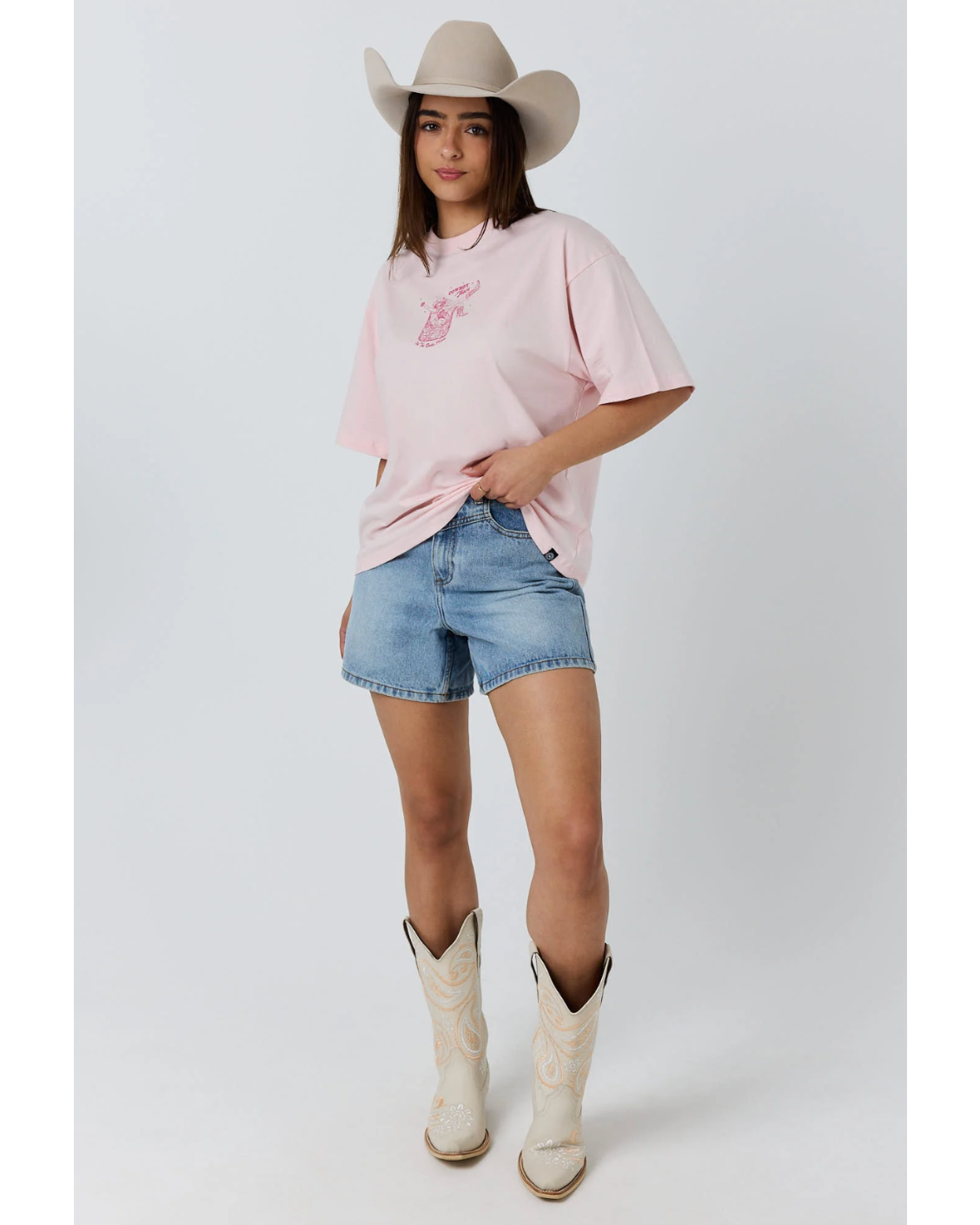 Ringers Western: Womans baby pink 100% cotton graphic tee, featuring a cowgirl graphic on the front - Texas Western Apparel New Zealand