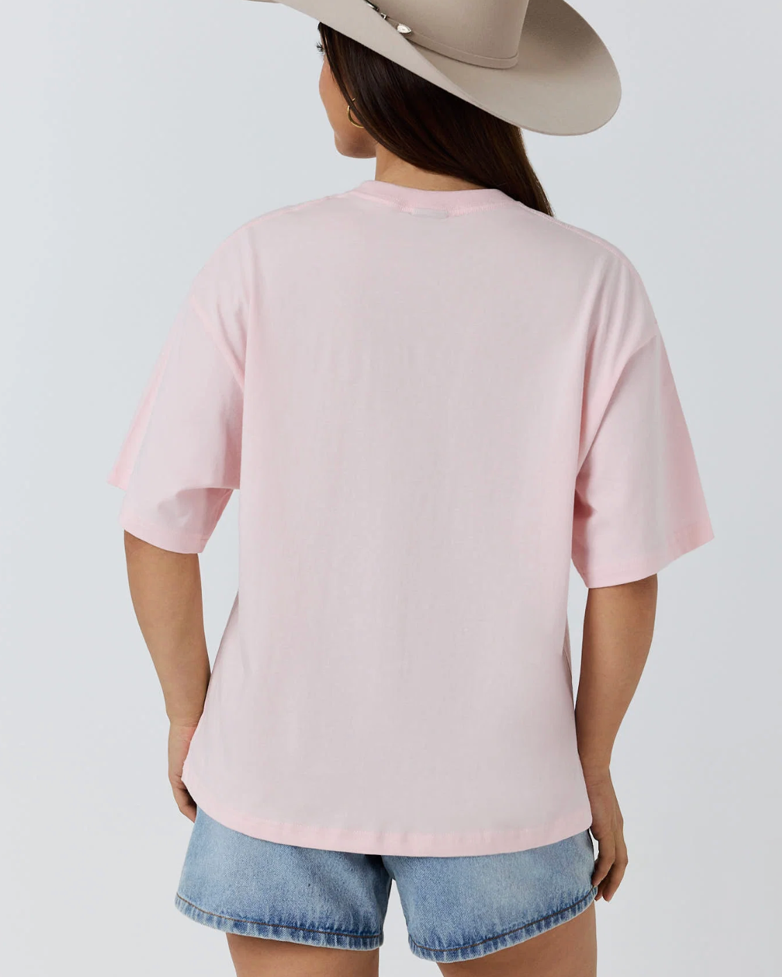 Ringers Western: Womans baby pink 100% cotton graphic tee, featuring a cowgirl graphic on the front - Texas Western Apparel New Zealand
