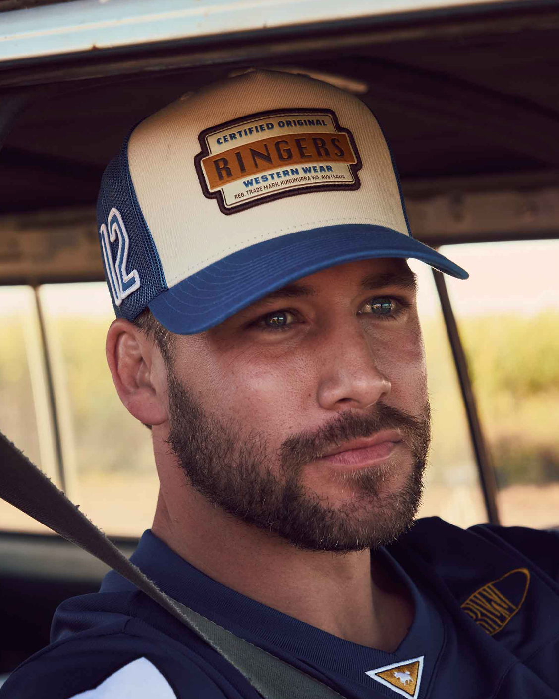 Ringers Western: Deep Fit Trucker Cap in Cream and Blue with an embroidered western patch on the front of the cap - Texas Western Apparel New Zealand