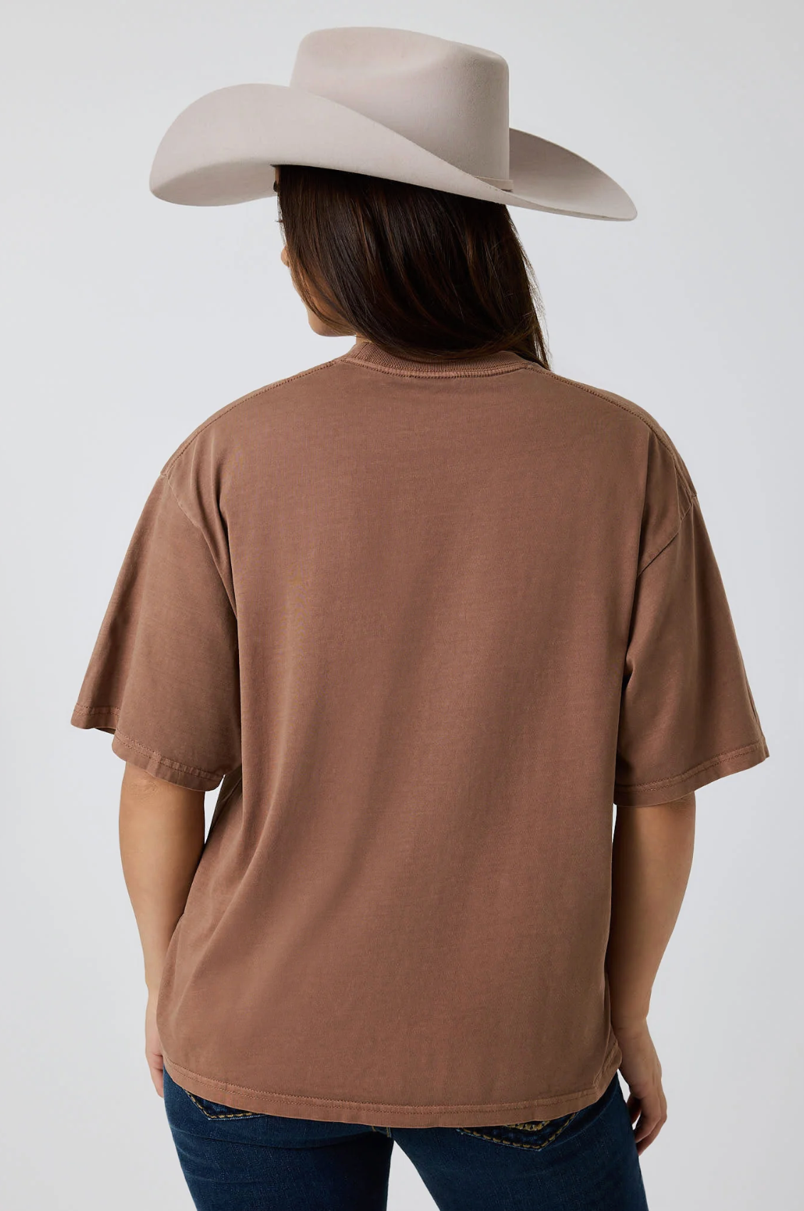 Ringers Western: Woman's 100% Cotton Brown Oversized Tee with a "Running Herd" Graphic on the front in pink - Texas Western New Zealand