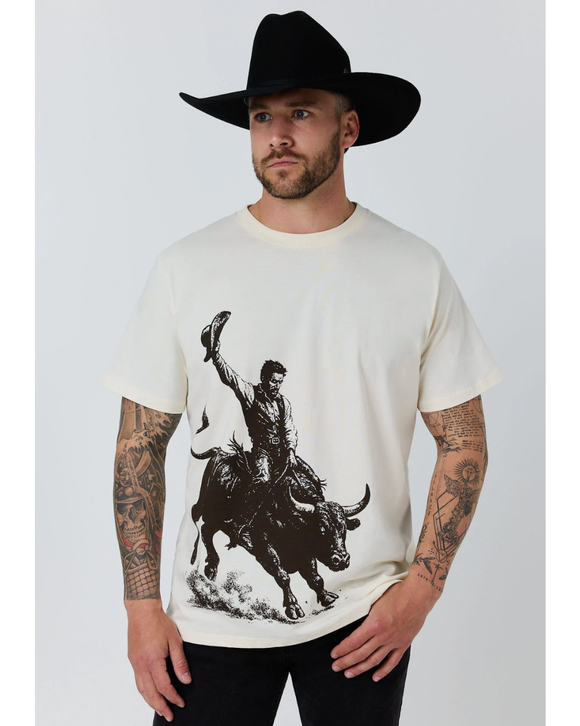 Ringers Western: Mens White 100% Cotton Tee Shirt featuring a graphic of a bull rider in black on the front - Texas Western New Zealand