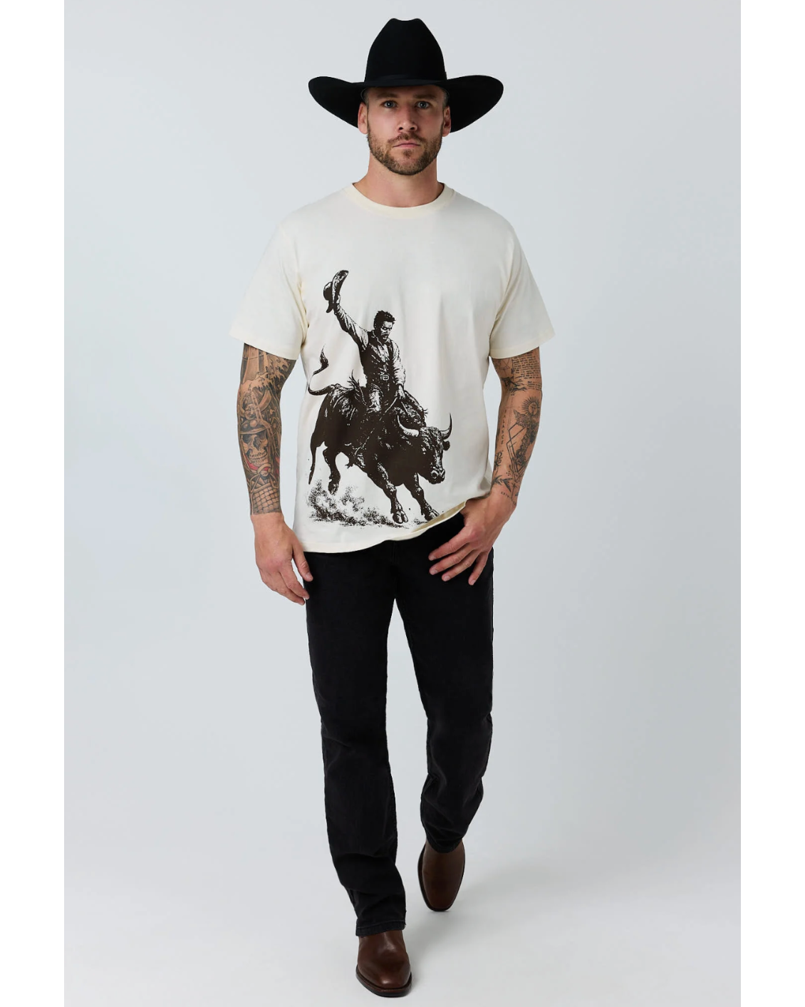 Ringers Western: Mens White 100% Cotton Tee Shirt featuring a graphic of a bull rider in black on the front - Texas Western New Zealand