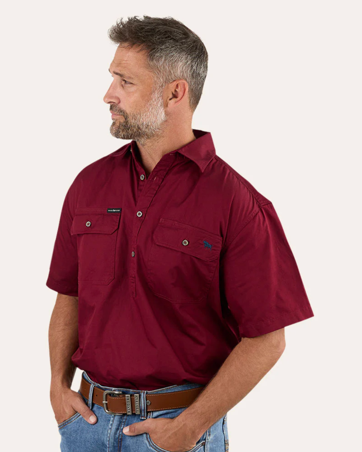 Ringers Western: Mens 100% Cotton 1/2 Button Work Shirt in the colour Burgundy featuring minimal embroidery of the ringers western bull - Texas Western New Zealand